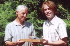 Model Maker Jeff Blomstad presents his model of "Shoo Shoo Baby" to John Howell, summer of 2000. Jeff grew up next to John, who shared some of his memories of flying "Shoo Shoo Baby" with Jeff. Later Jeff became involved in the restoration effort of a B-17 in Seattle and is active in the Washington State Chapter of the 8th AF Historical Society. Information and photos provided by Gregory Pierce, President 8th AFSH Washington State.