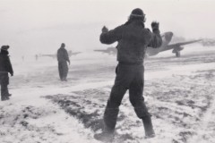 One of Merle Olmsted's favorite photos. Dec 44 Group planes waved into take off position in a snow storm.