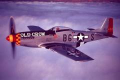 Beautiful photo by Earl Smith of Bud flying restored P-51D Old Crow.
