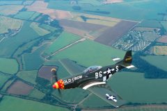 2001 Bud flying the SHF P-51 Old Crow over Leiston Airfield.