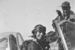 Bud in the cockpit of P-51B Old Crow. Crew chief Otto Heino on the wing.
