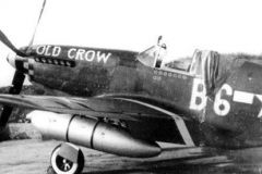 Bud's third P-51B Old Crow, tail number 43-24823, Old Crow in large lettering and red and yellow checkered nose of the 357th FG. Bud's crew chiefs painted white side-wall tires with barn paint.