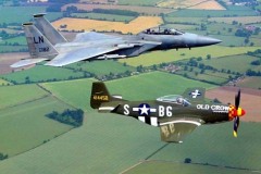 Bud flies an F-15 in formation with Scandinavian Historic Flight P-51 Old Crow